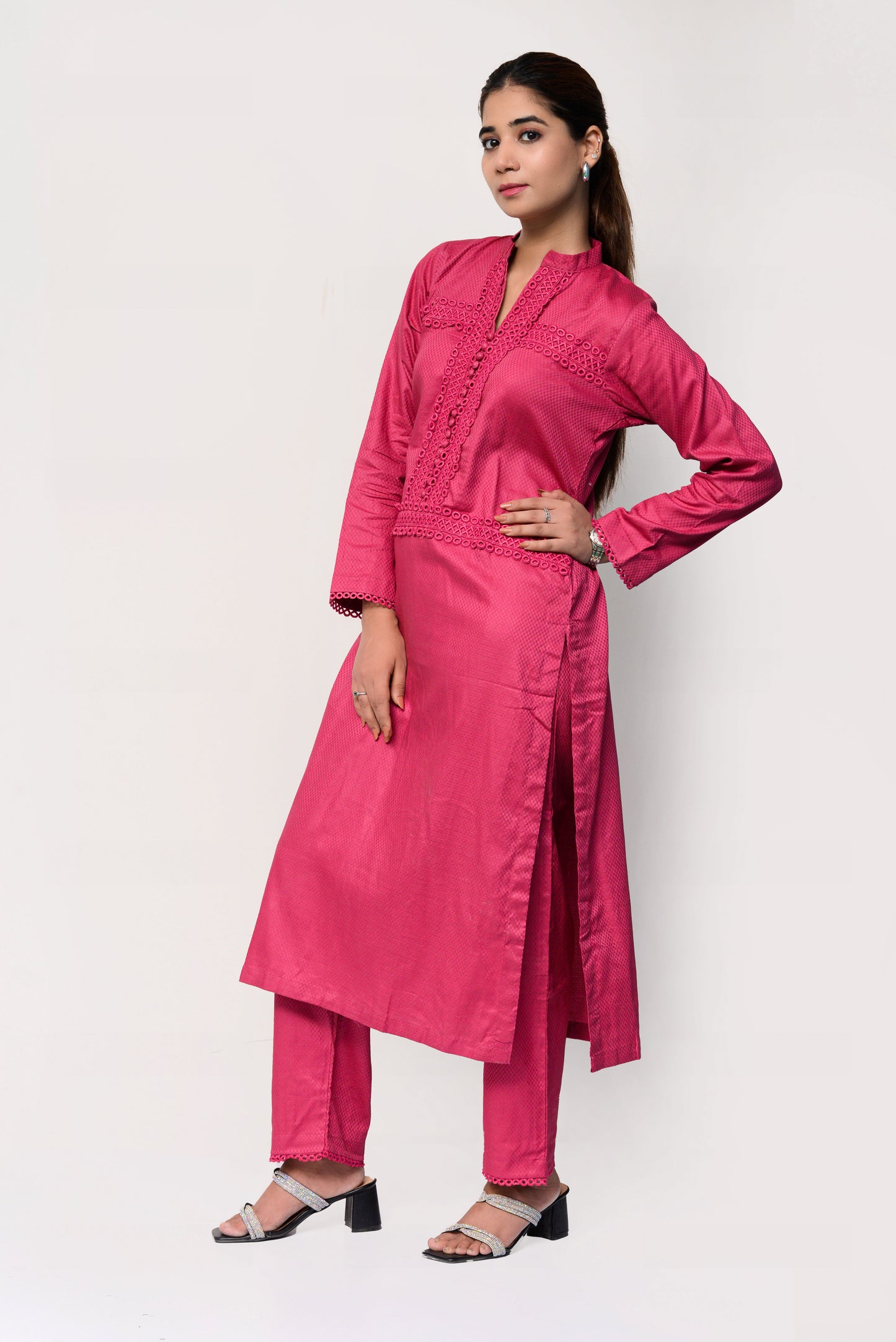 Woman wearing a pink traditional outfit with a white background
