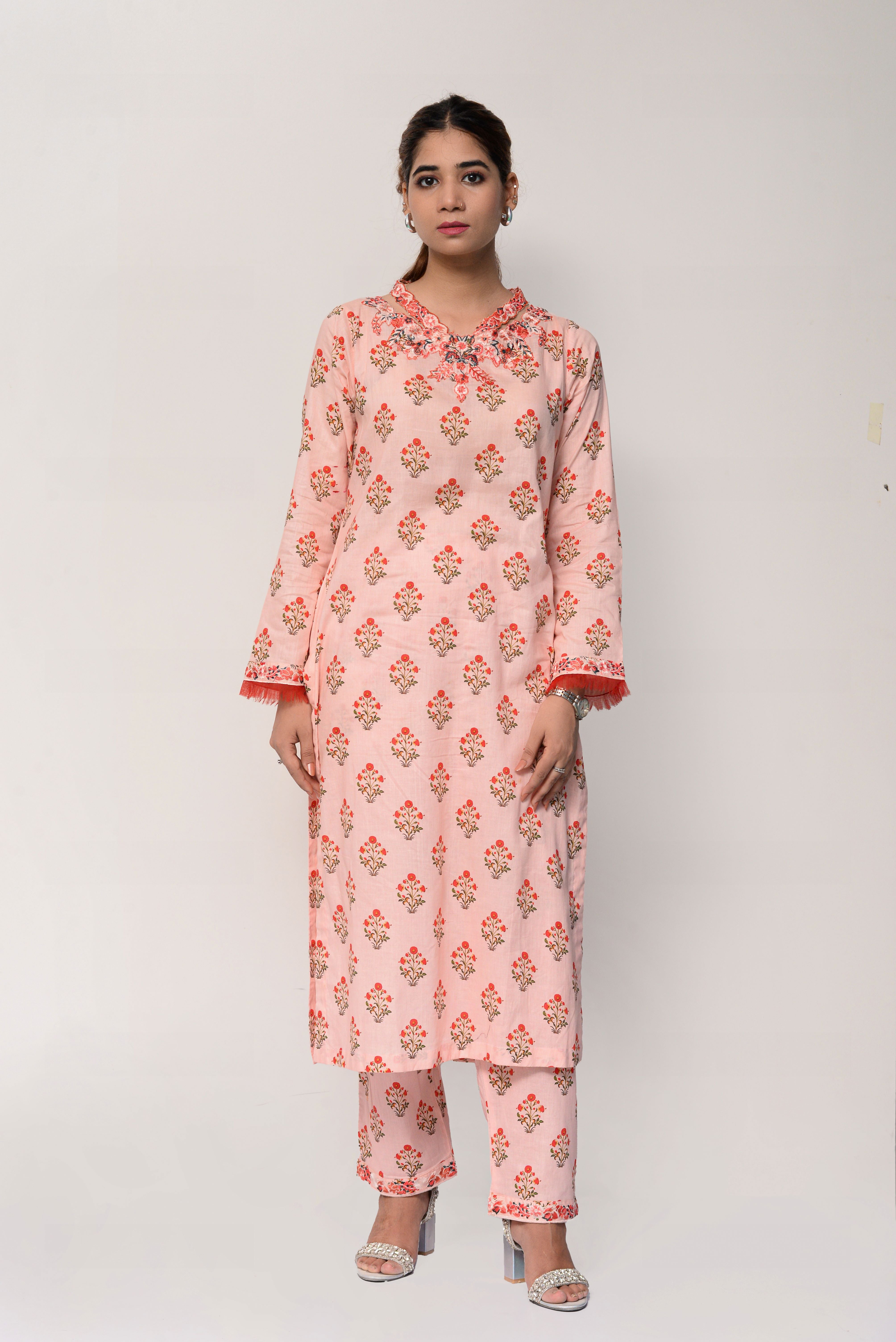 Woman wearing a pink floral dress on a white background