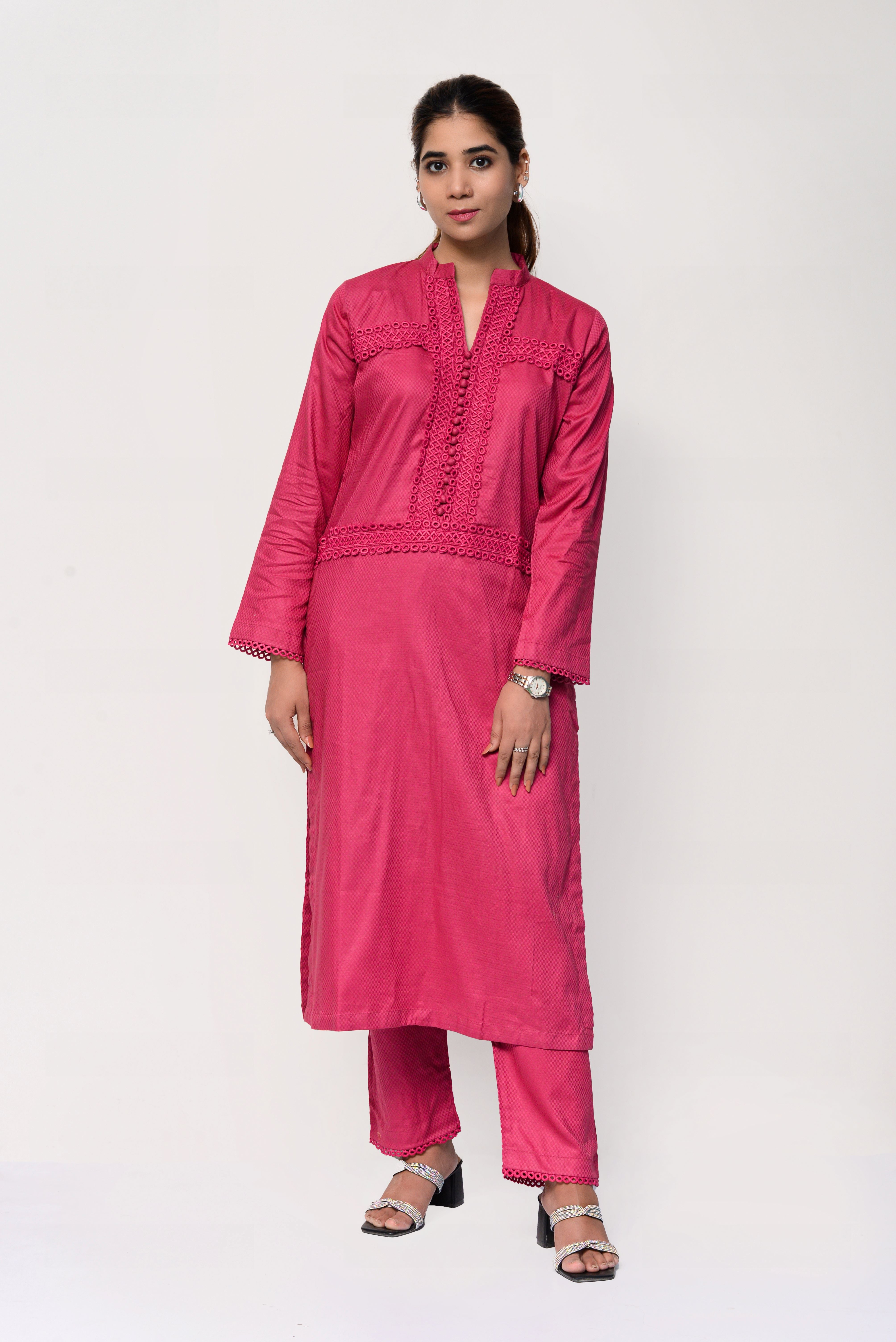 Woman wearing a pink traditional outfit with a white background